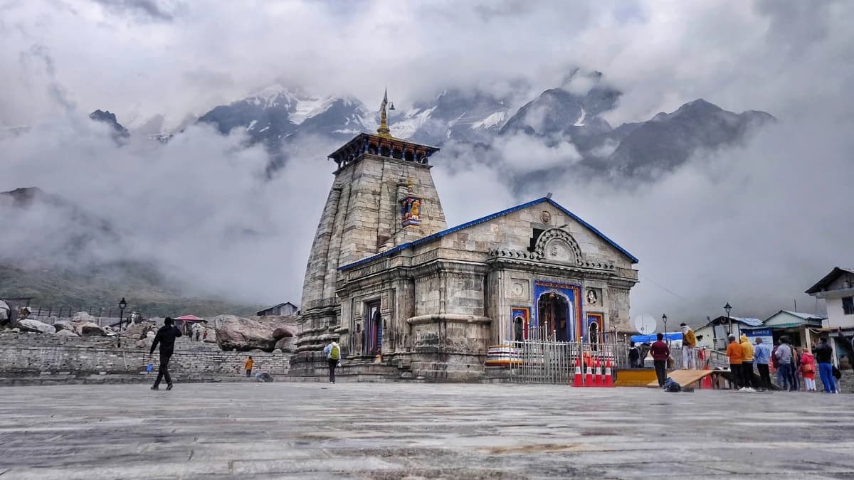 Kedarnath Temple under low cloud cover and mist after mountain weather shift