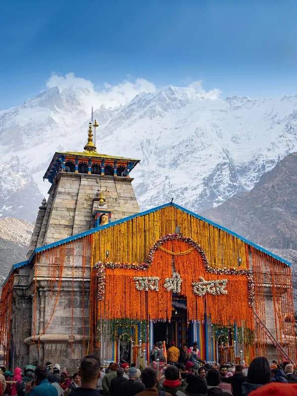 Kedarnath Temple with snow-covered Himalayan peaks behind it